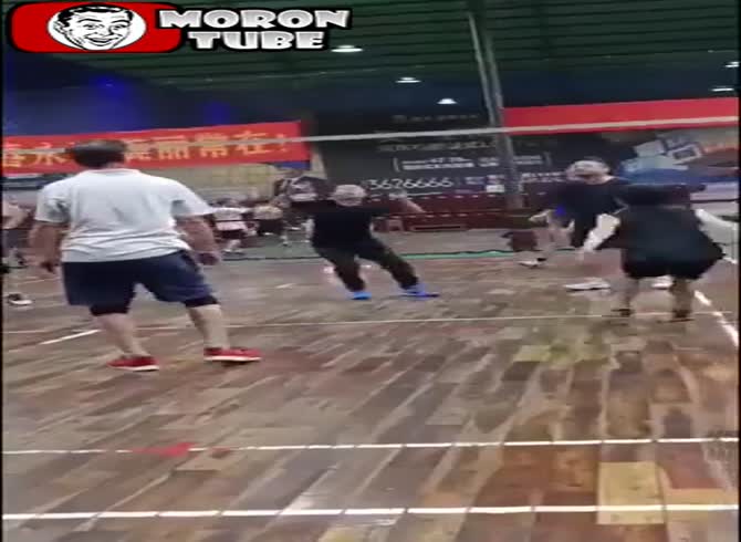 Video :A man is on the floor during a game of volleyball